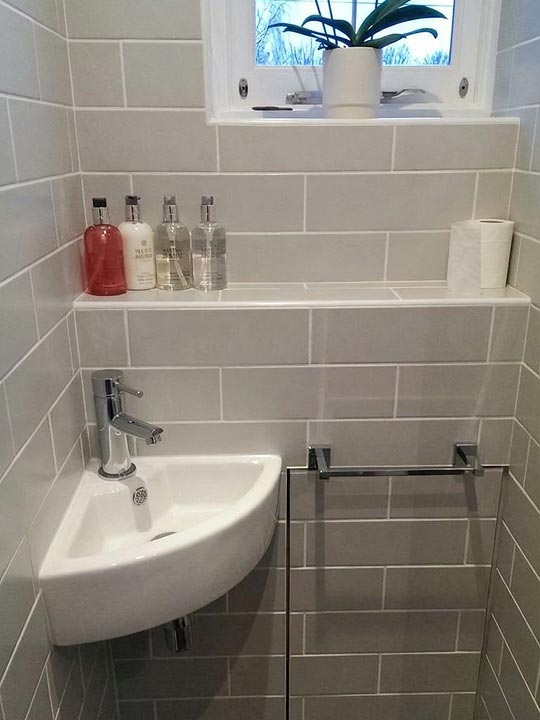 Cloakroom wall and floor tiling work